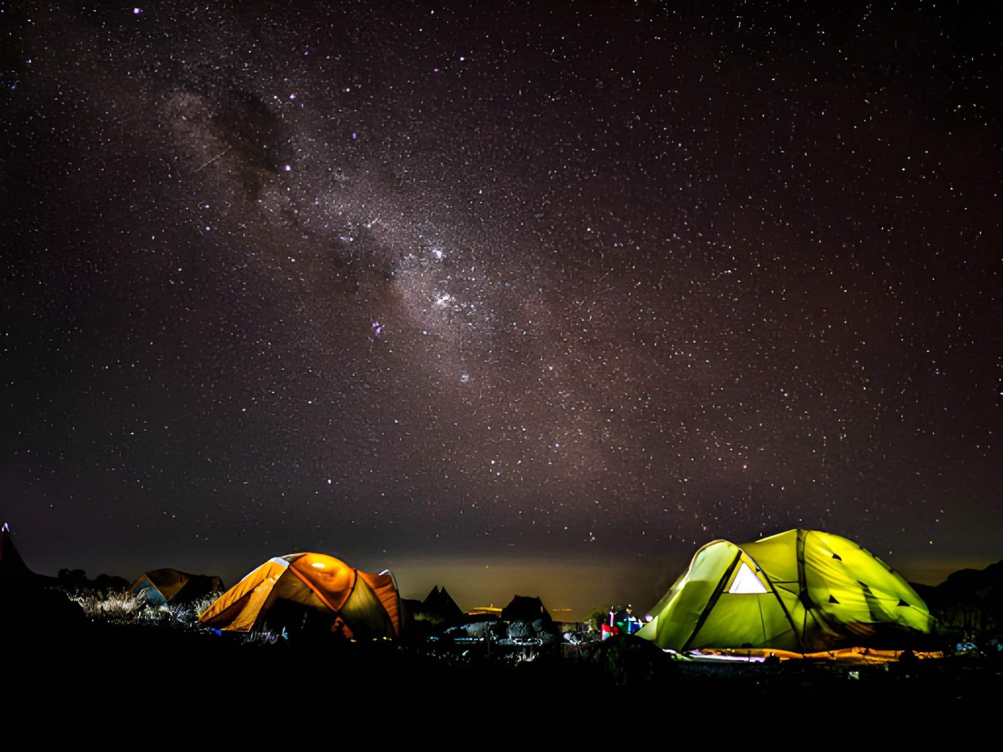 Lantern-lit safari tent under the stars